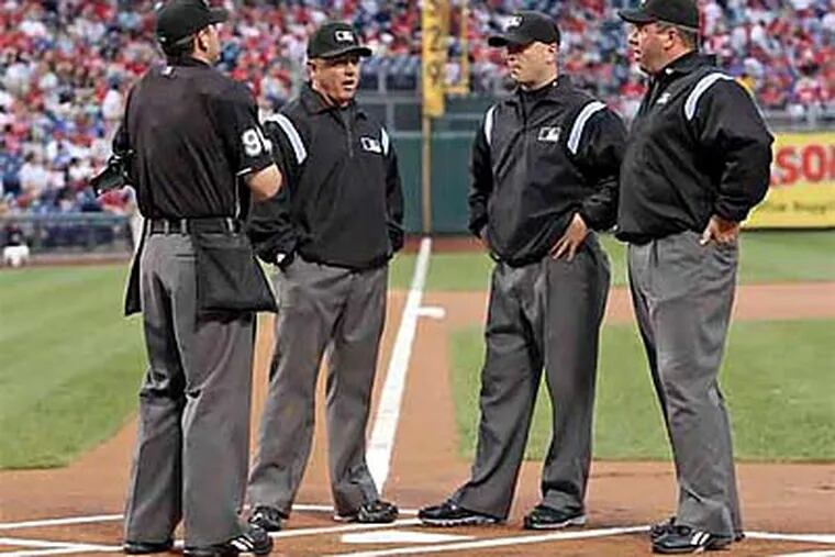 Umpires have been in the spotlight throughout the Phillies' series with the Astros. (Steven M. Falk/Staff Photographer)