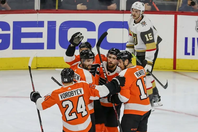 The Flyers' Michael Raffl, right celebrates his goal against the  Golden Knights with teammates during the second period at the Wells Fargo Center.