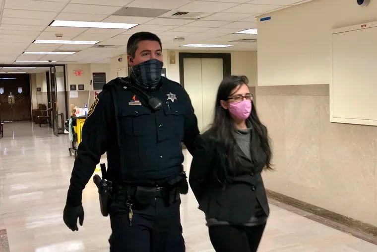 Naseema Sami is escorted into a courtroom in the Montgomery County Courthouse. Sami, 46, was found guilty but mentally ill in the deaths of two women.