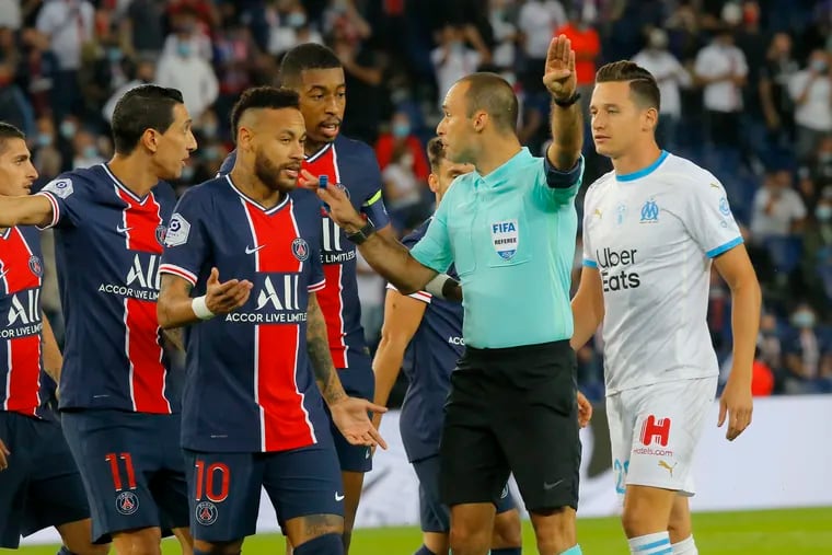 Paris Saint-Germain star Neymar (10) accused a Marseille player of racially abusing him during a game that included five red cards, and a brawl in the final minutes.