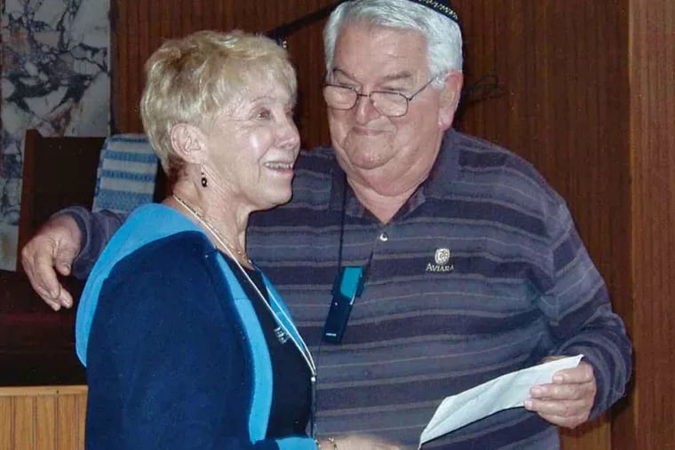 Ruth Morley, who retired after nearly 40 years at the Klein JCC in Bustleton, shown in 2004 presenting a check to Jose Levy, president of a synagogue in Cuba.