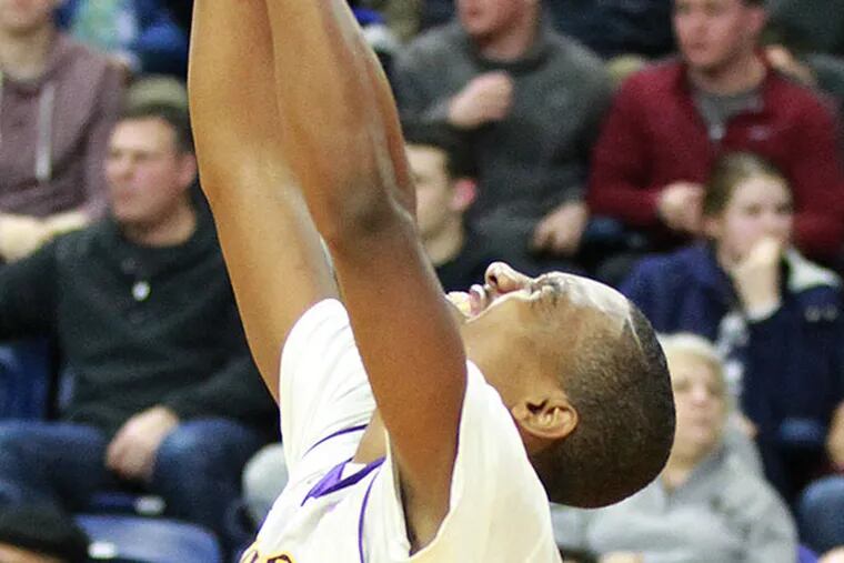 Tony Carr of Roman Catholic celebrates as Carroll misses its final
shot attempt. Roman defeated Archbishop Carroll 61-58 in the Catholic
League boys' basketball semifinal at the Palestra on Feb. 18, 2015.   
(Charles Fox/Staff Photographer)