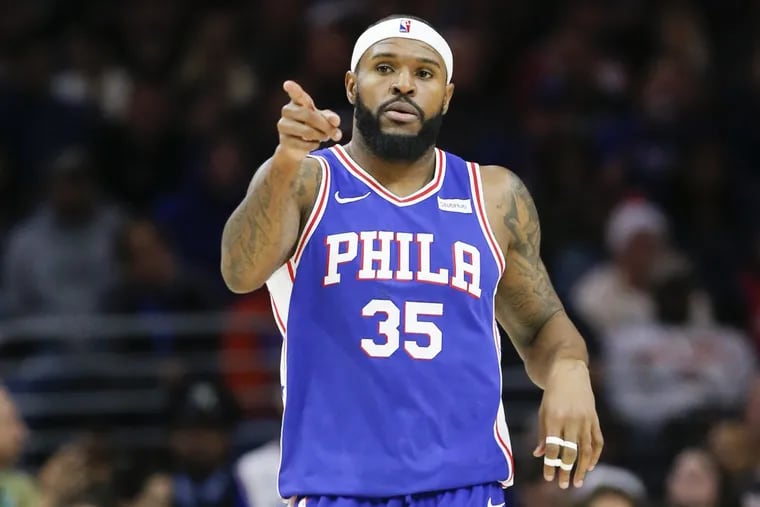 Sixers forward Trevor Booker points during a game against the Knicks.