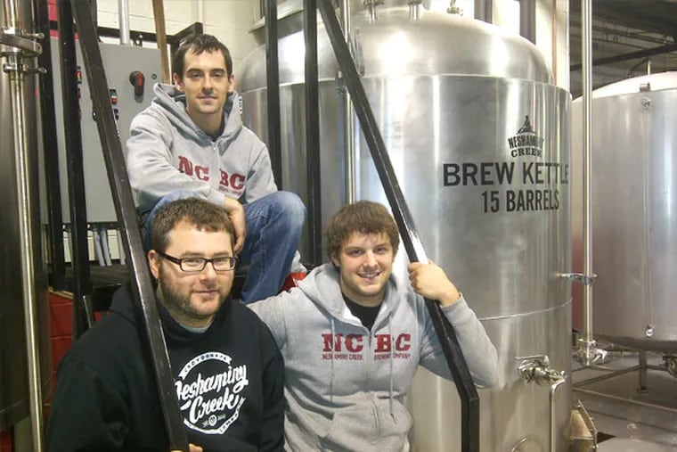 Neshaminy Creek Brewing Co. brewmaster Jeremy Myers (left), with assistants Steve Capelli (rear) and RobJahn (right).