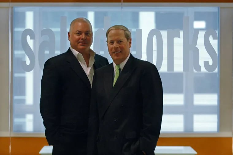 John Scardapane (left) and Vernon W. Hill II stand in front of the Saladworks office in Conshohocken in February 2008, when they announced Hill’s investment in the company.