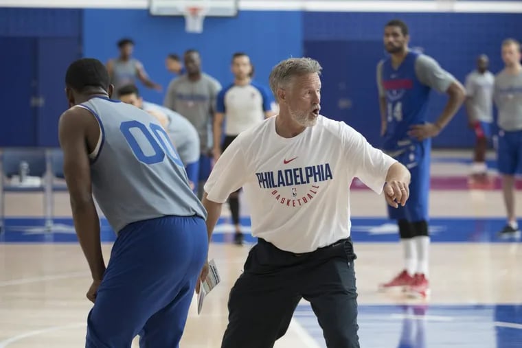 Brett Brown, center, directs his team in practice on Wednesday, Sept. 27, 2017.