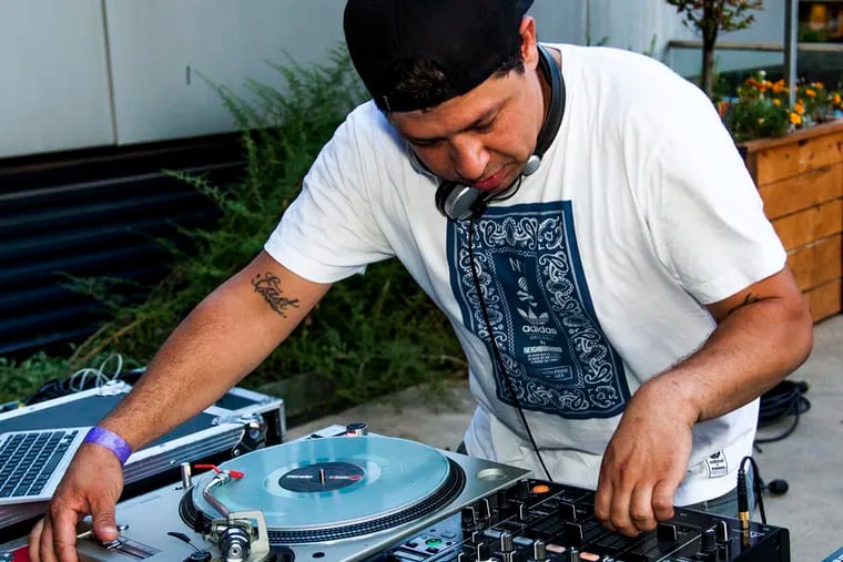 DJ Cosmo Baker playing at a special event in Philadelphia on Sunday, August 16, 2015. ( Tim Blackwell / Philly.com )
