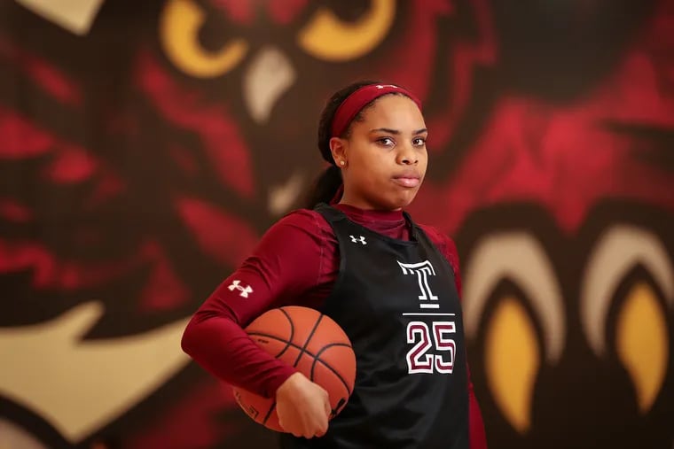 Temple women's basketball player Mia Davis poses for a portrait before a practice.
