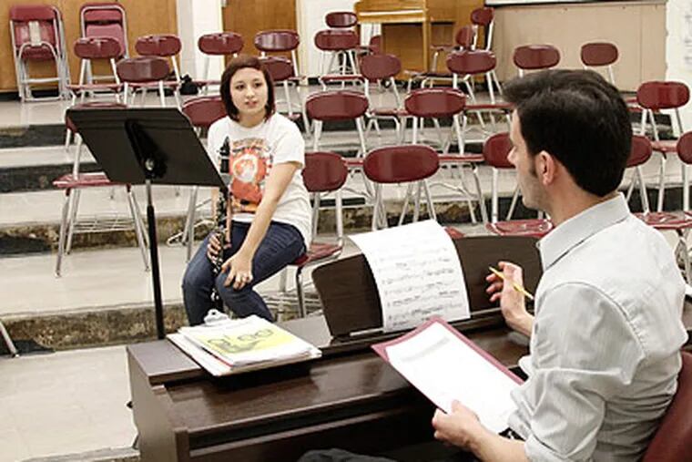 Victoria Kuhnel, 16, of Penns Grove, answers questions from Glassboro High School Choral Music Director Nick Forte during her audition on Wednesday. (Elizabeth Robertson / Staff Photographer)