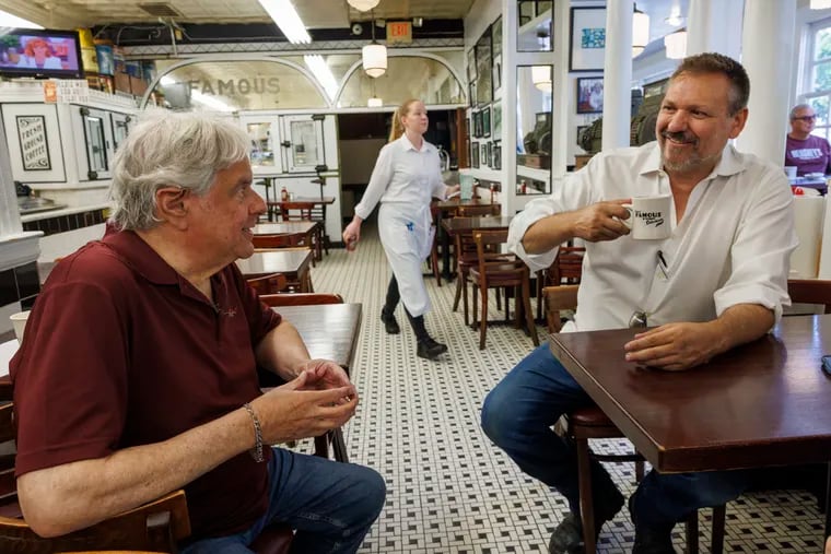 Famous 4th Street Deli owner Al Gamble (right) chats with former owner David Auspitz on May 31, 2024.