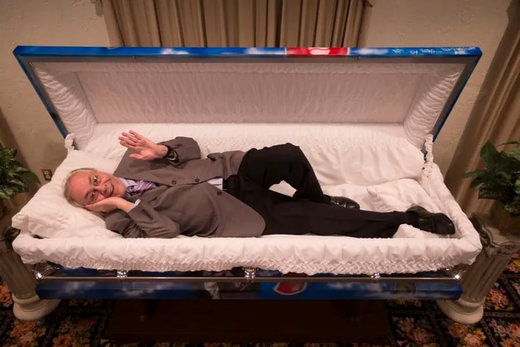 Making some people happy? Inquirer and Daily News columnist Stu Bykofsky in a coffin for a gag shot to go with a column he wrote about putting the "fun" in funerals.