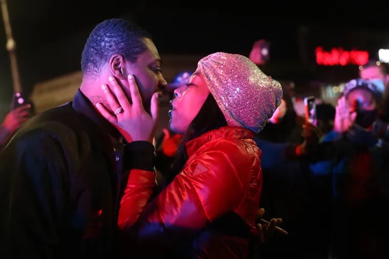 Maurice Small, 32, proposed to Tanesha Pennington, his girlfriend of 8 years, in the intersection of 52nd and Chestnut, as a line of police officers with riot shields looked on.