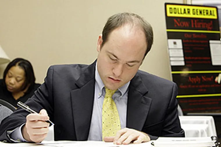Steve Pruitt of Belle Chasse, La., filling out an employment application during a Dollar General job fair in Metairie, La., yesterday. Average hourly earnings rose to $18.36 in December, up 0.3 percent - slightly more than expected - from the previous month.