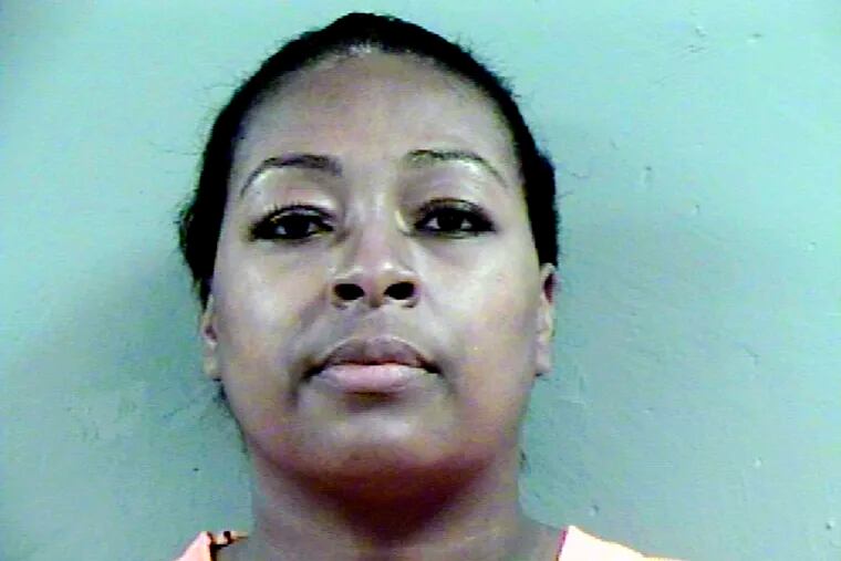 This photo provided by the Madison County Detention Center shows Courtney Rainey, a local school board member and the City of Canton, Miss., director of human and cultural needs, on Thursday, Dec. 6, 2018. Rainey is among six people indicted on accusations that they tried to influence a 2017 election in the city of Canton by improperly helping people fill out absentee ballots and voting despite being disqualified. (Madison County Detention Center via AP)