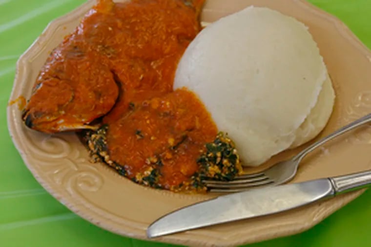 Starchy fufu, fish and greens at Wazobia - &quot;come in&quot; in three languages.