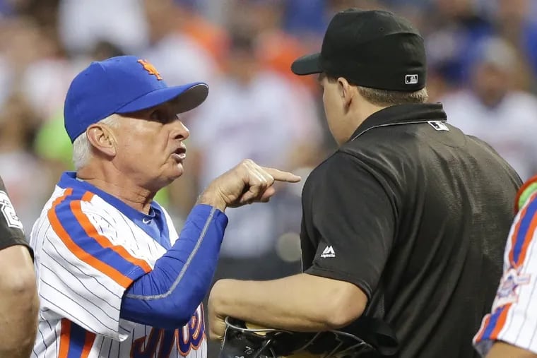 New York Mets manager Terry Collins argues with Umpire Adam Hamari after starting pitcher Noah Syndergaard was ejected during the third inning of a baseball game, Saturday, May 28, 2016.