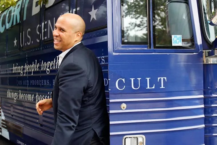Newark Mayor and U.S. Senate candidate, Cory Booker, steps off his campaign bus during a stop at the North Gate Senior Complex in Camden, NJ on August 12, 2013. ( DAVID MAIALETTI / Staff Photographer )