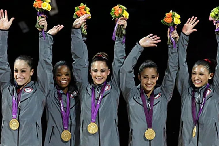 From left, Jordyn Wieber, Gabrielle Douglas, McKayla Maroney, Alexandra Reisman and Kyla Ross celebrate after winning the gold medal. (Gregory Bull/AP)