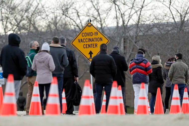 People waited in long lines at the Gloucester County COVID-19 vaccine site at Rowan College South Jersey.
