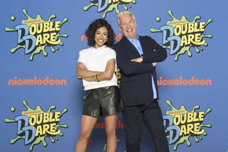 Liza Koshy and Marc Summers in “Double Dare.” Koshy will host, and Summers will provide color commentary.