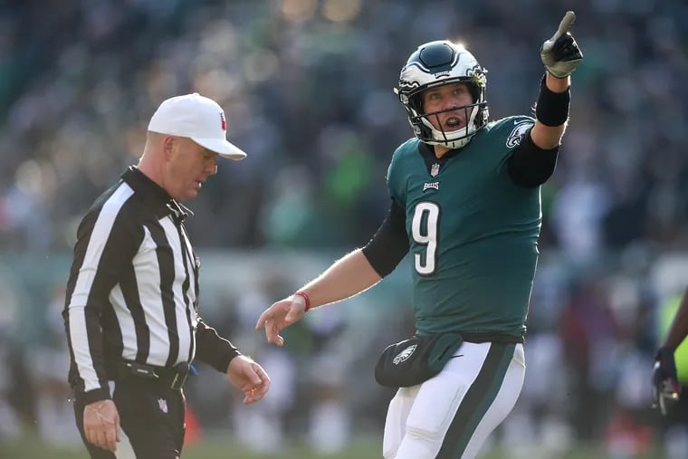 Nick Foles argues with an official during the second quarter of the Eagles' win over the Texans on Sunday.