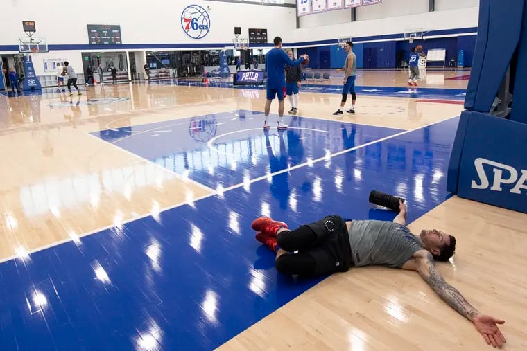 JJ Redick stretch during practice at the 76ers Training Complex in Camden, New Jersey. Monday January 7, 2018. JOSE F. MORENO / Staff Photographer