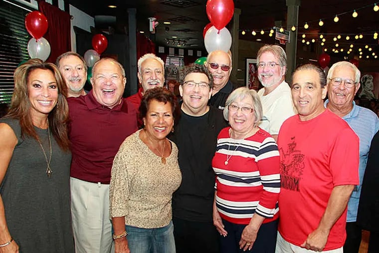 Angelo Lutz (above center) hosted dozens of family members yesterday at his Kitchen Consigliere in Collingswood, N.J.