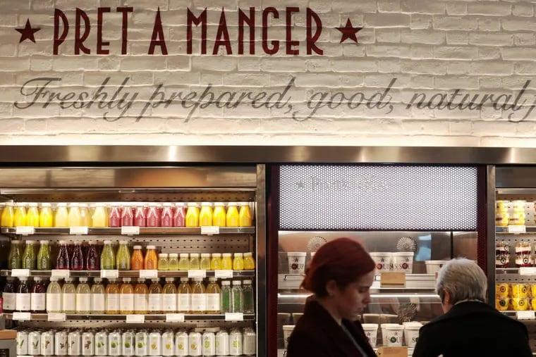 Customers look at products for sale inside a branch of food retailer Pret a Manger Ltd. in London.