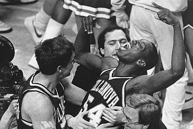 Villanova's Ed Pinckney yells out as he is surrounded by teammates after the Wildcats defeated Georgetown and claimed the NCAA Championship in 1985. (Gary Landers/AP file photo)