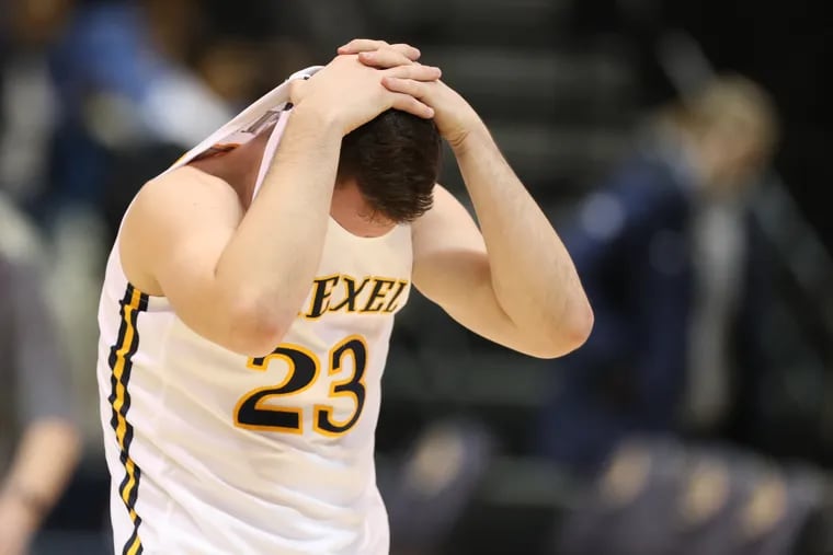 Drexel's Trevor John walks off the court after missing DrexelÕs final shot that would have tied the game against College of Charleston on Feb. 9, 2019. Drexel lost 86-84.