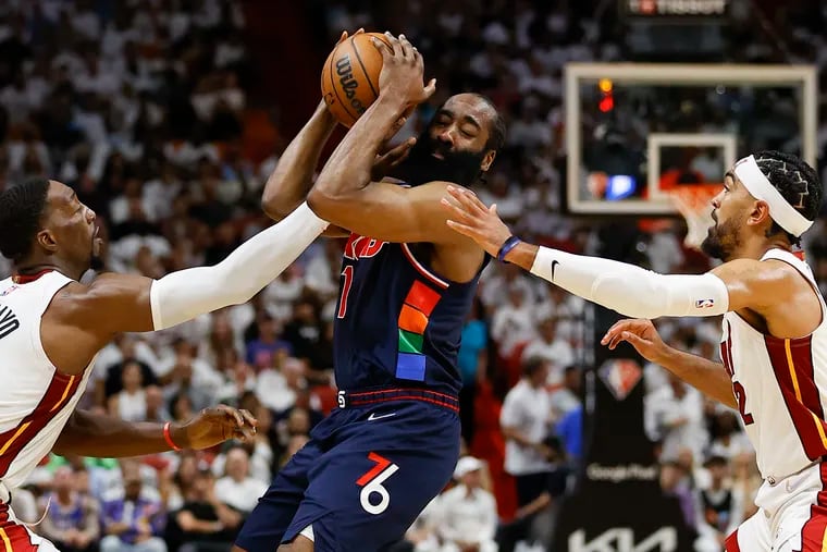 Sixers guard James Harden gets double-teamed by Miami Heat center Bam Adebayo and guard Gabe Vincent in the second quarter of Game 2.