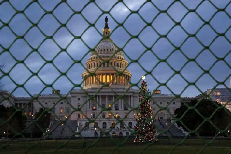 In this Dec. 22, 2018 file photo, the Capitol is seen on the first morning of a partial government shutdown in Washington.