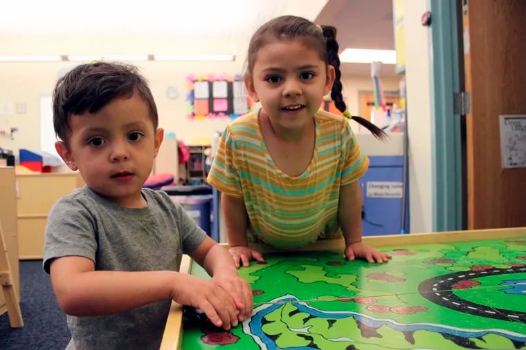 Students Arelyanna, 3, and Javier, 2, play with their toy cars to wrap up the day at Cuidando Los Ninos in Albuquerque, N.M. The charity provides housing, child care and financial counseling for mothers, all of whom will benefit from expanded Child Tax Credit payments that will start flowing in July to roughly 39 million households.