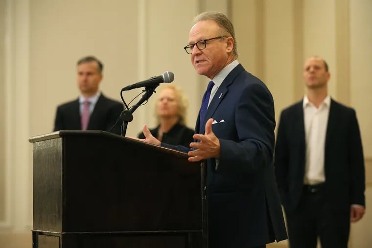 Moshe Porat, former dean of Temple University's Fox School of Business, speaks during a news conference announcing a $25 million defamation lawsuit against the university at the Hilton hotel on City Avenue in Philadelphia on May 2, 2019.
