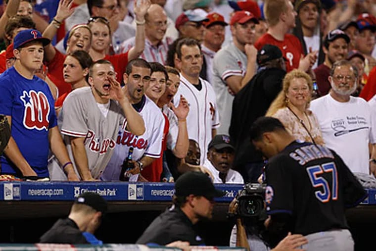 Phillies fans gave Johan Santana an earful as he gave up seven runs during the fourth inning. (Ron Cortes/Staff Photographer)