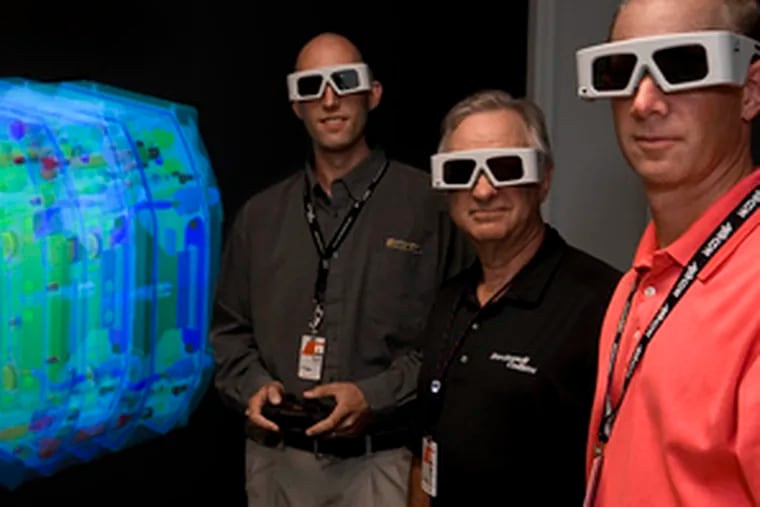 Jack Harris (center), Ryan Wheeler (left) and Jim Lorenz of Rockwell Collins at headquarters in Cedar Rapids, Iowa. The maker of cockpit instruments and aviation electronics plans to hire 1,300 engineers this year.