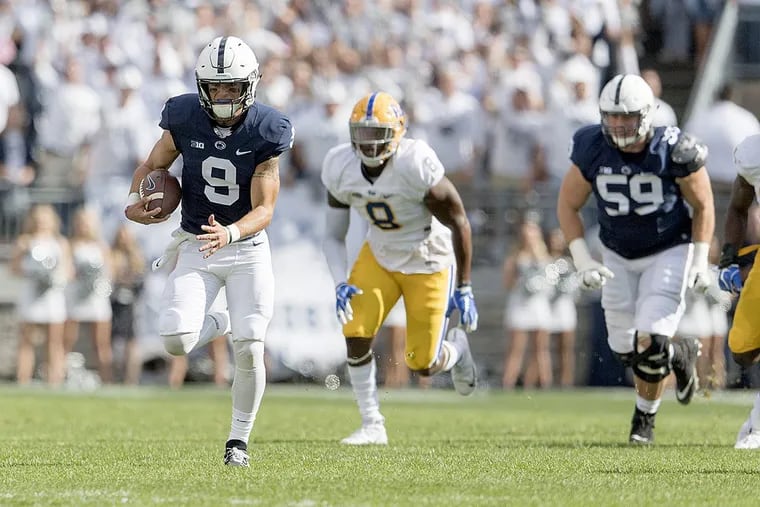 Penn State quarterback Trace McSorley (9) runs down the field for a first down against Pitt on Saturday, Sept. 9, 2017, at Beaver Stadium in University Park, Pa. Penn State won, 33-14.