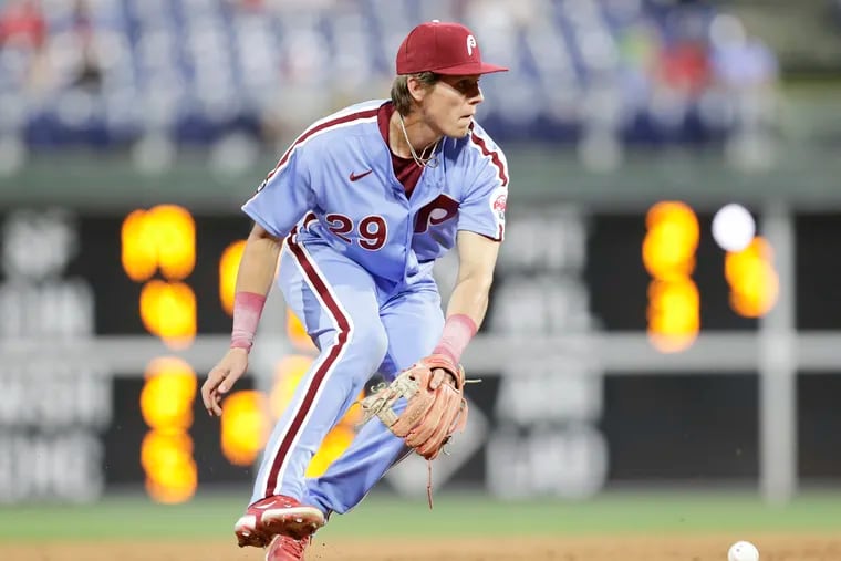 Phillies shortstop Nick Maton looks up after booting the baseball against the Miami Marlins on May 20.
