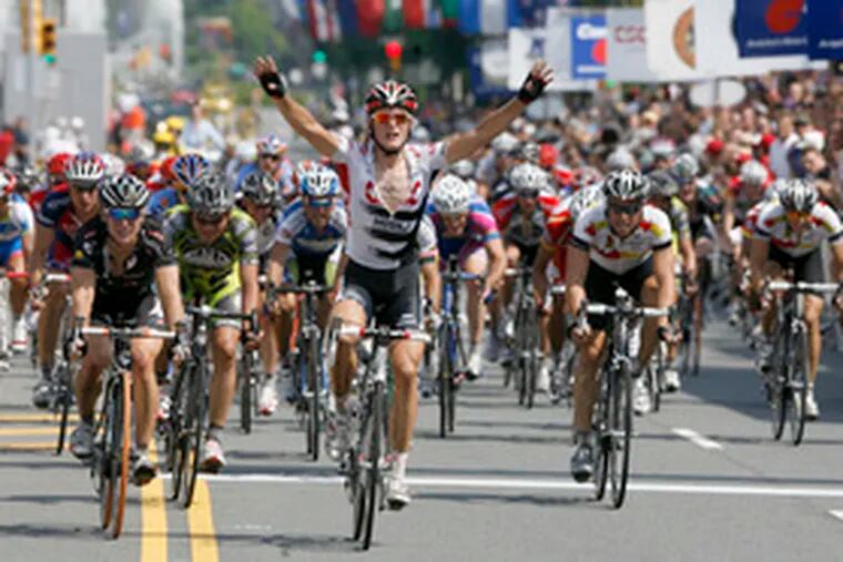 Matti Breschel of Denmark raises his arms in victory after a dash to the finish line in the Commerce Bank Philadelphia International Cycling Championship. Breschel edged out American Kirk O’Bee in the race’s closest finish.