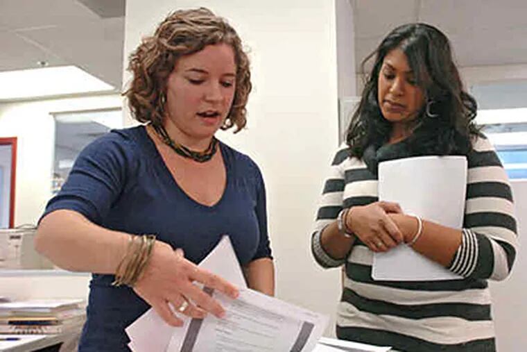 Kristina Moon (left), who once worked for AmeriCorps, is working for the Juvenile Law Center, a public-interest legal organization. (CLEM MURRAY / Staff Photographer