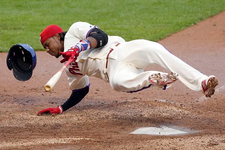 Phillies' Maikel Franco falls to the dirt after foul tipping the baseball against the Atlanta Braves during the seventh-inning on Saturday, May 21, 2016 in Philadelphia.  YONG KIM / Staff Photographer