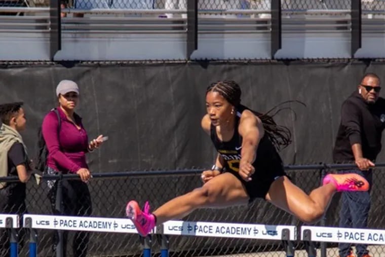 Kalani Witherspoon competes in hurdles.