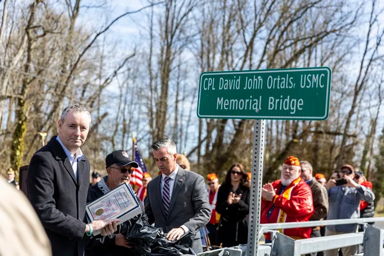 People gather Saturday in Middletown Township, Bucks County, for the dedication of a bridge named for David Ortals, a Marine corporal who died in Vietnam in 1970.