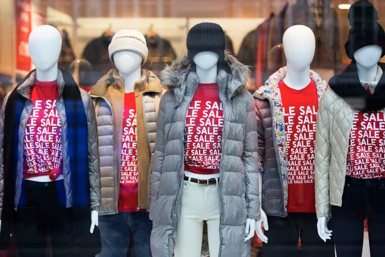 T-shirted mannequins alert customers to a clothing sale at a Uniqlo store, operated by Fast Retailing Co., on Regent Street in London. The United Kingdom may overtake France this year to become the world's fifth-largest economy, behind the United States, China, Japan, and Germany, according to a report by the Center for Economics and Business Research.