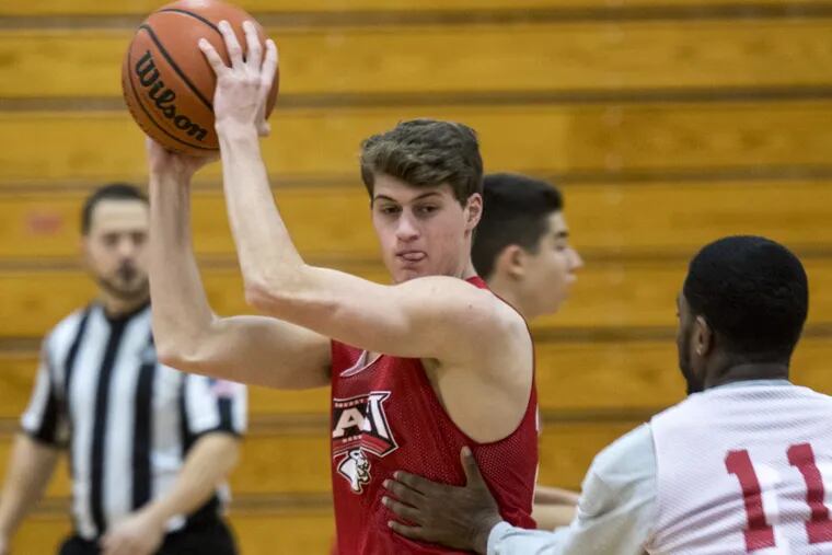 Action shot of Cherry Hill East senior hoops player Jake Bernstein (with ball) who was cut from his middle school teams but through hard work has developed into contributors for the varsity team this year. Photo take December 11, 2017.