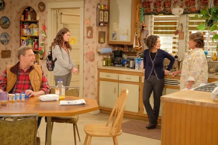 John Goodman (left) with Emma Kenney, Sara Gilbert, and Roseanne Barr in a scene from ABC’s “Roseanne,” which returns with nine new episodes beginning March 27