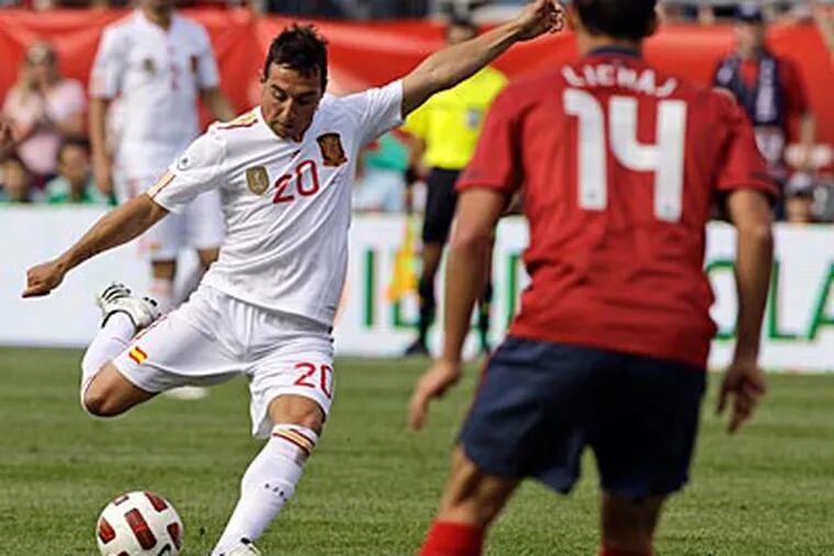 Spain's Santiago Cazorla takes a shot on goal as the United States on Saturday. (Stephan Savoia/AP Photo)