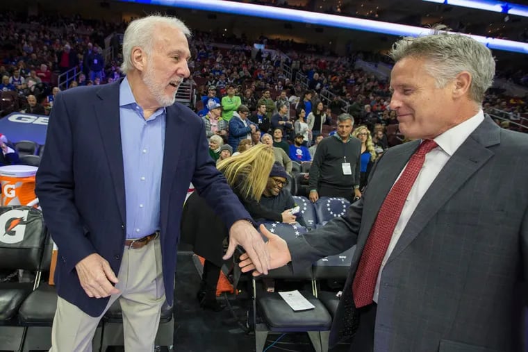 Former Sixers coach Brett Brown (right) with Gregg Popovich of the Spurs before their game at the Wells Fargo Center on Jan 3, 2018. Brown was once an assistant coach with the Spurs under Popovich.