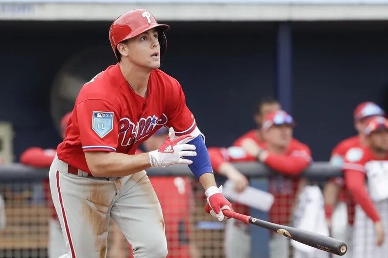 Phillies Scott Kingery watches his home run against the Tampa Bay Rays during a spring training game.