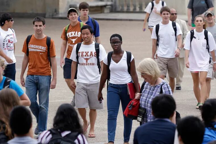 FILE - In this Thursday, Sept. 27, 2012 photo, students walk through the University of Texas at Austin campus in Texas. This giant flagship campus - once slow to integrate - is now among the most diverse the country. A decade ago, the U.S. Supreme Court upheld the right of colleges to make limited use of racial preferences in admitting students. (AP Photo/Eric Gay, File)